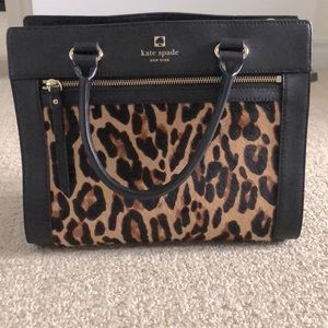 Kate Spade black purse with fur (cheetah print).